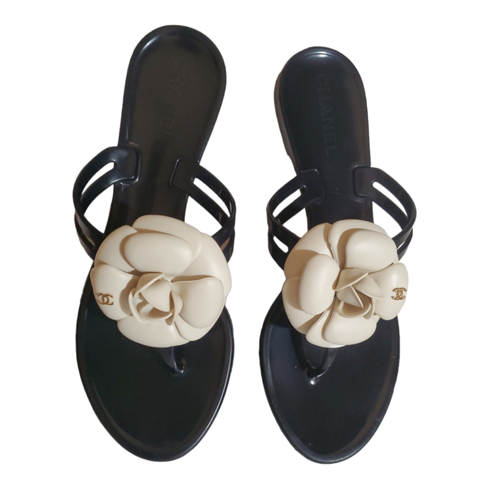 Authentic Chanel rubber black sandals with camellia flower interlocking cc logo.